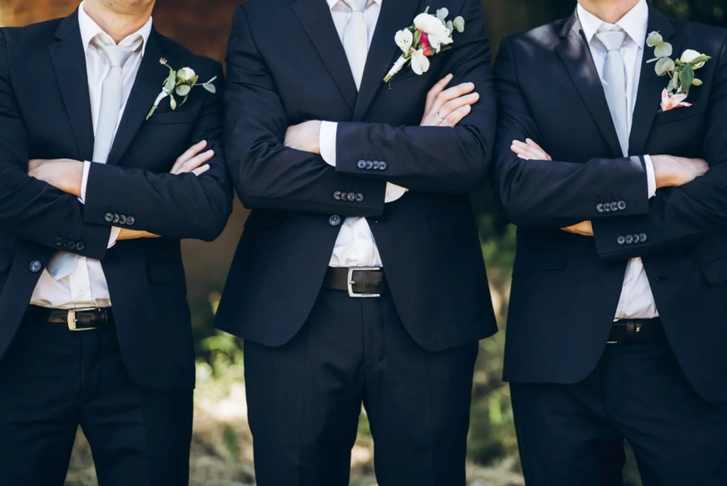 stylish-groom-in-suit-posing-with-groomsmen-in-gar-2025-04-02-04-23-17-utc_result